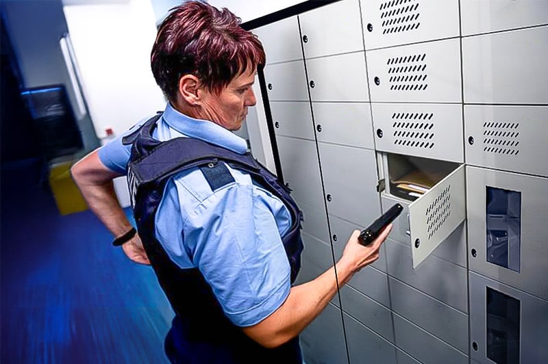 A police officer retrieving equipment from a smart locker