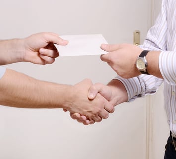 Patient handing over their valuables to a caregiver before going to the hospital