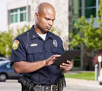 An officer uses a tablet