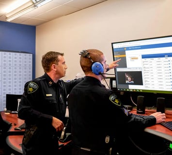 Law Enforcement Officers looking at stats coming from the smart armory locker