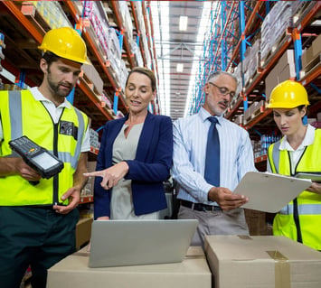 Handheld scanners are used by warehouse workers to manage inventory