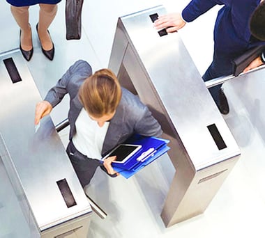 An employee using a card to go through the access control system
