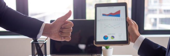 A team shares a chart with data about improved efficiency due to smart systems implementation