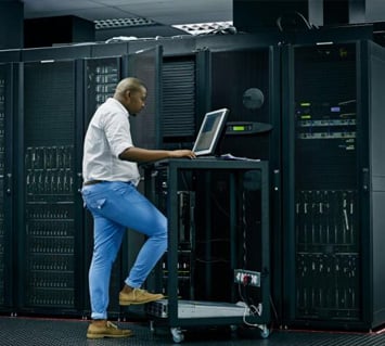 An IT Employee working on a Data Center