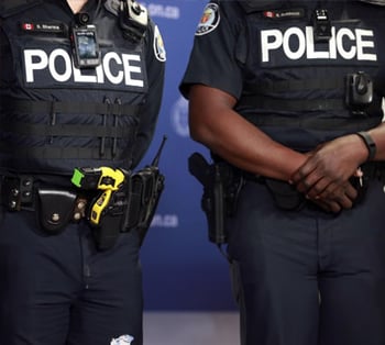 Two Police Officers Standing Side by Side