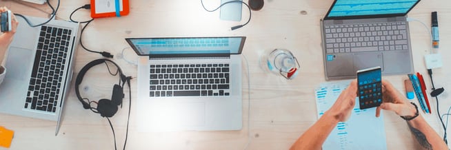 An employee using a smart equipment management system to manage laptops