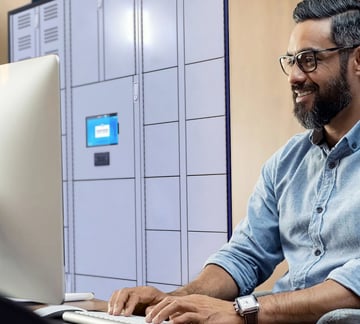 Man working with an smart locker in the back