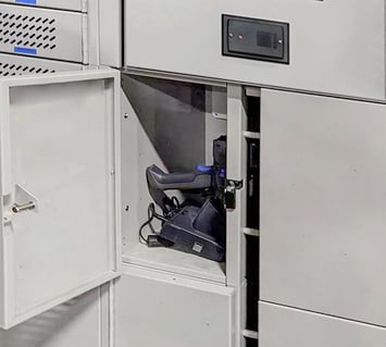 A smart locker stores and charges a warehouse scanner