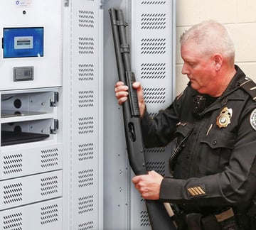 Police Officer Using a Smart Locker to Store a Long Gun