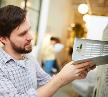 Tablet being stored in a smart locker by a student