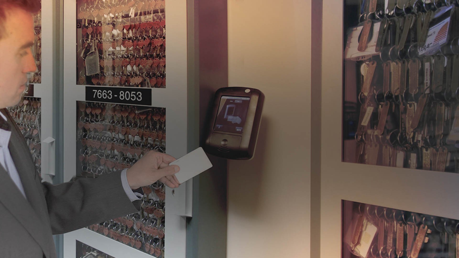 An access control card reader is used to open a key management system cabinet