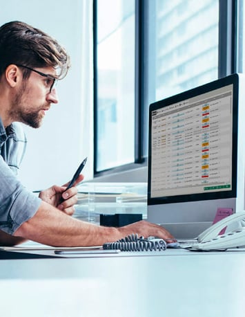 On a screen, an employee views the corporate physical security management data 