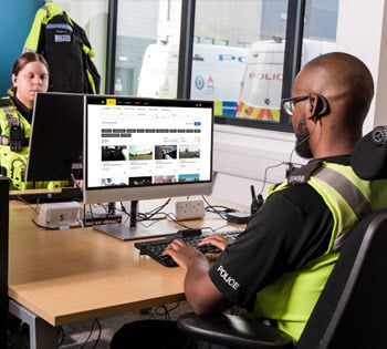 Two evidence technicians managing digital evidence