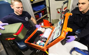 Medical kits and medications are stored and tracked in a smart locker by an EMS employee