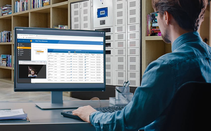 Man in Blue Shirt Operating A Smart Locker Software in a University or College