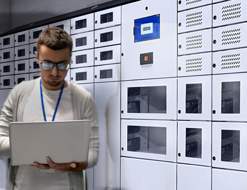 In a data center, an IT employee uses a laptop that had previously been stored in a smart locker
