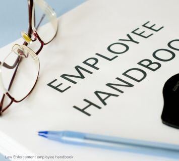 Employee handbook for law enforcement personnel, emphasizing the importance of documented weapons management policies and officer responsibilities.