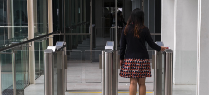Women entering building scanning ID - Physical Security