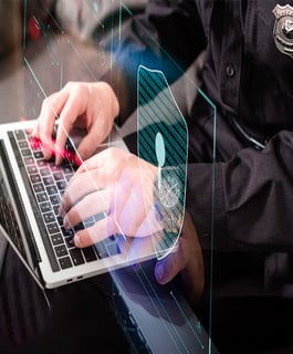 Police Officer Using a Computer