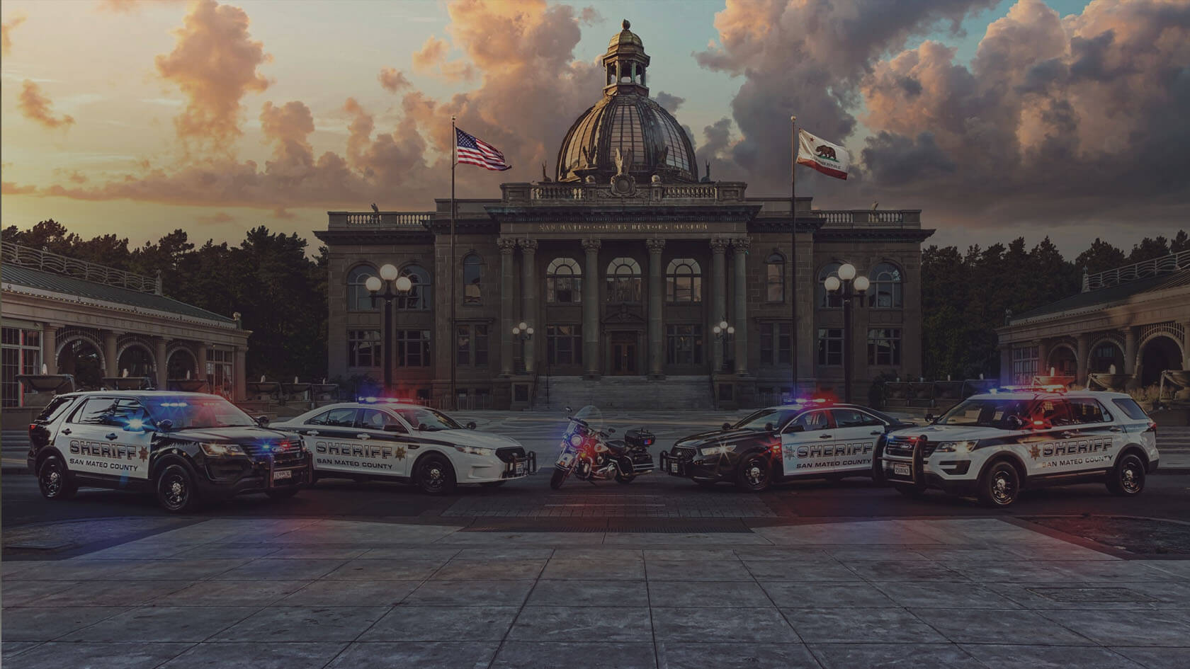 San Mateo Sheriff's Office Case Study - A line of police cars is parked in front of the San Mateo County History Museum