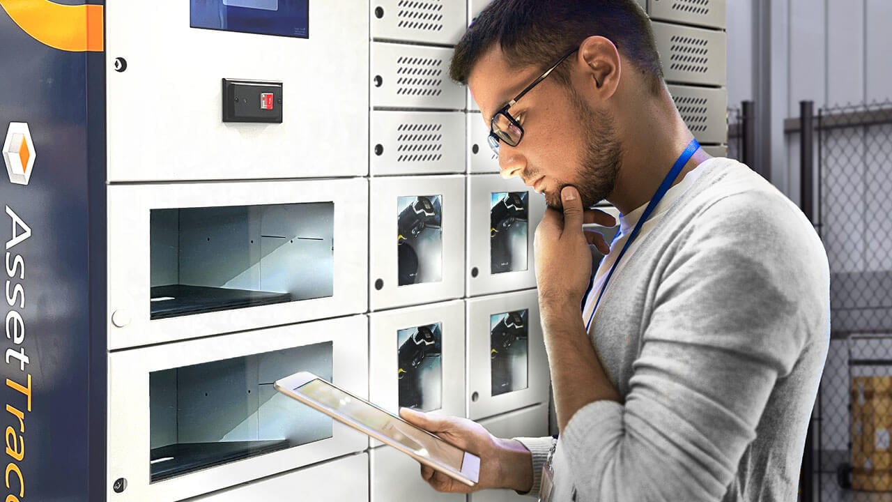An employee using a smart locker to manage the company equipment