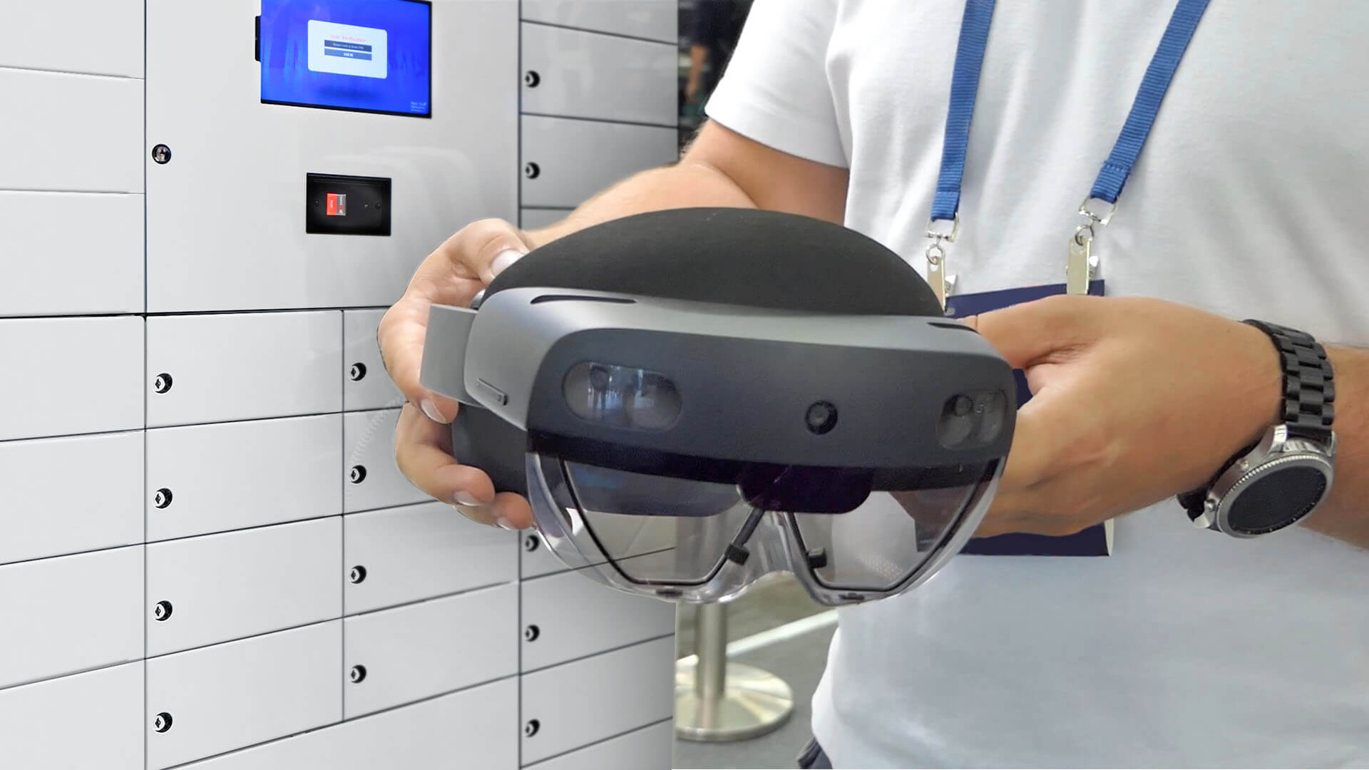 An employee uses a smart locker to safely store holo lenses, a critical asset.