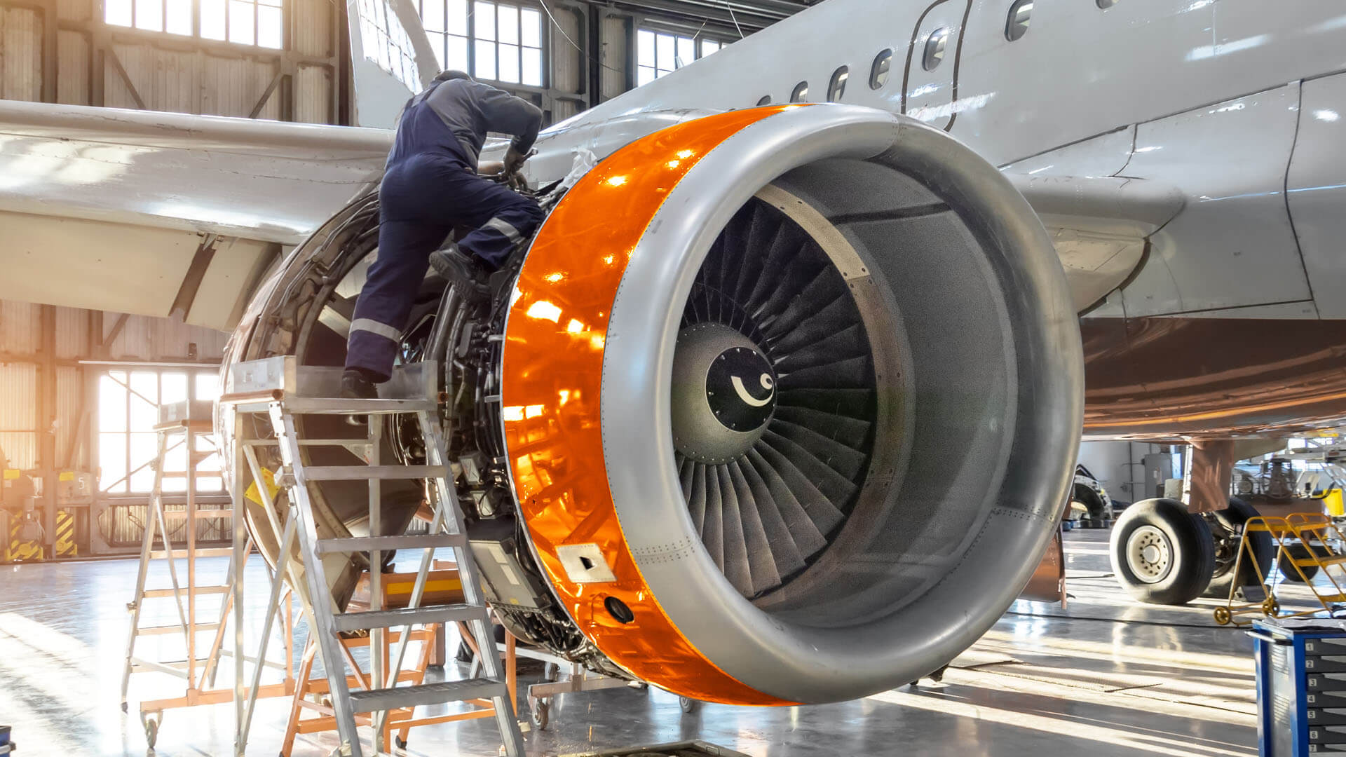 An Aircraft Maintenance Engineer Repairing an Aircraft Engine