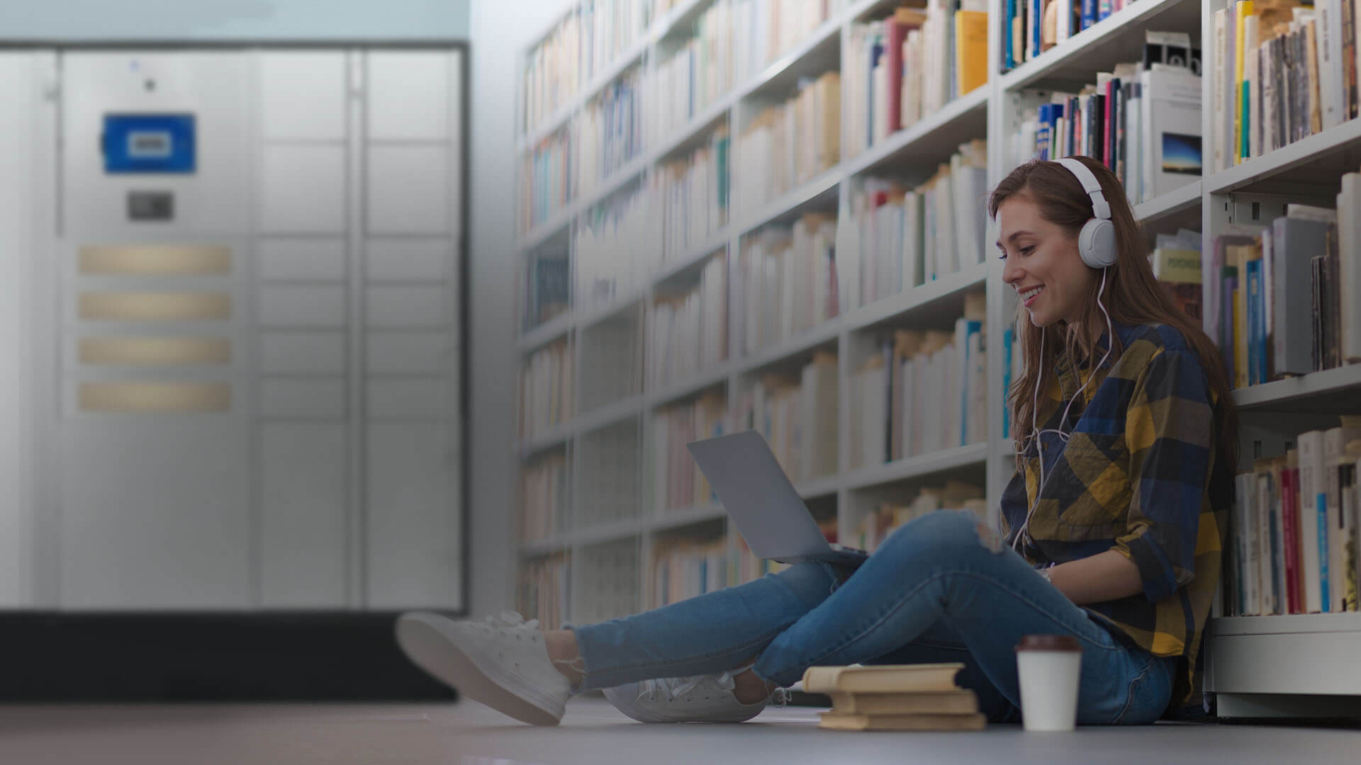 A Woman Using a Rented Laptop in a College Library