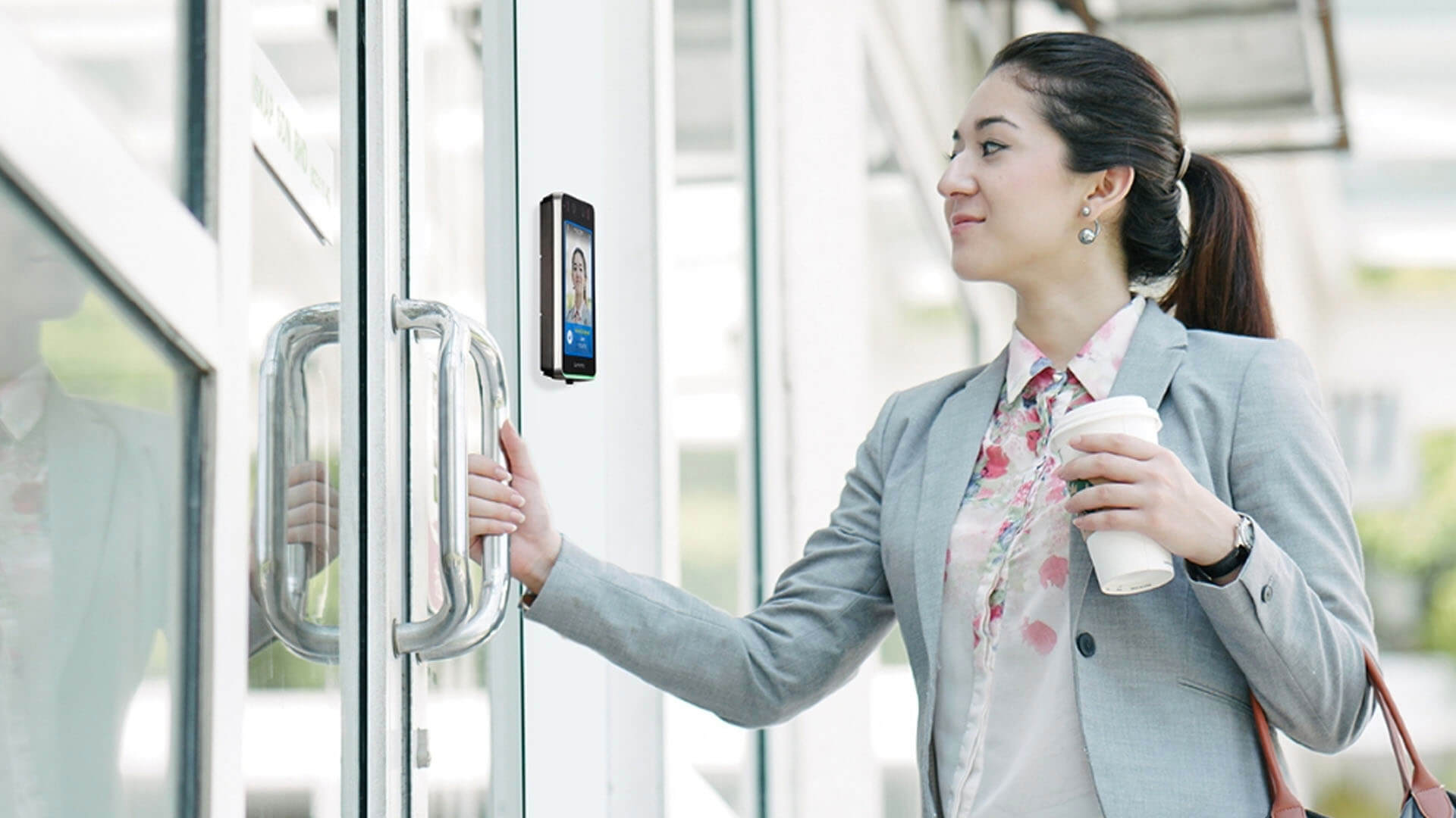 An employee using a physical access control system (PACS)