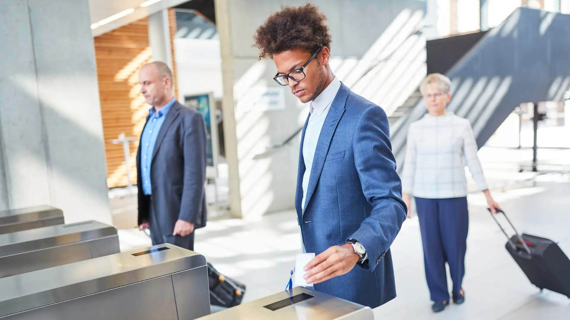 An employee accessing the organization with a card through a main entrance access control terminal