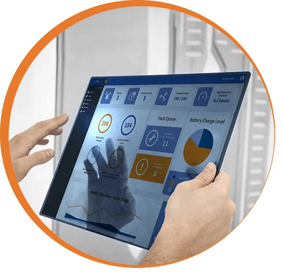 Hands holding a tablet displaying AssetTracer intelligent locker dashboard for real-time asset tracking and equipment visibility.